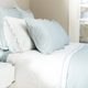 Image for article titled This Crane and Canopy Duvet Cover Has Made My Bedroom So Much More Chic